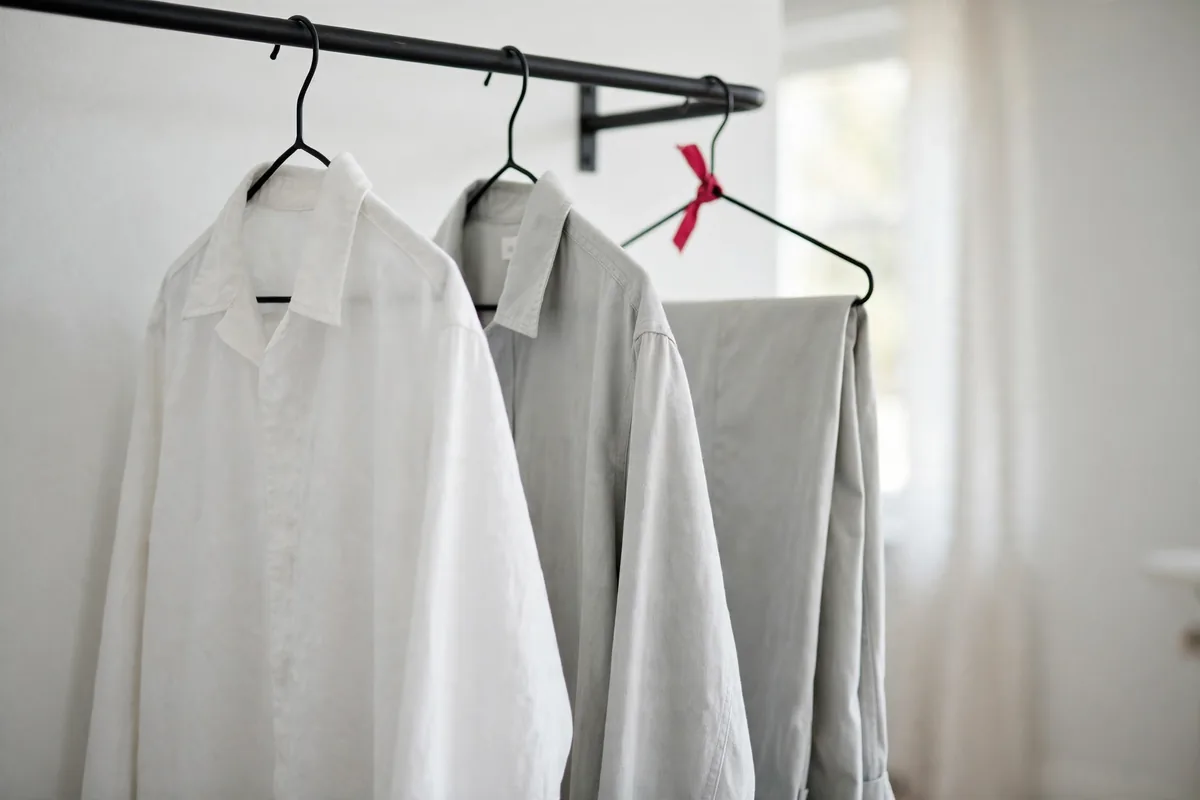 Plain work shirts on a rail